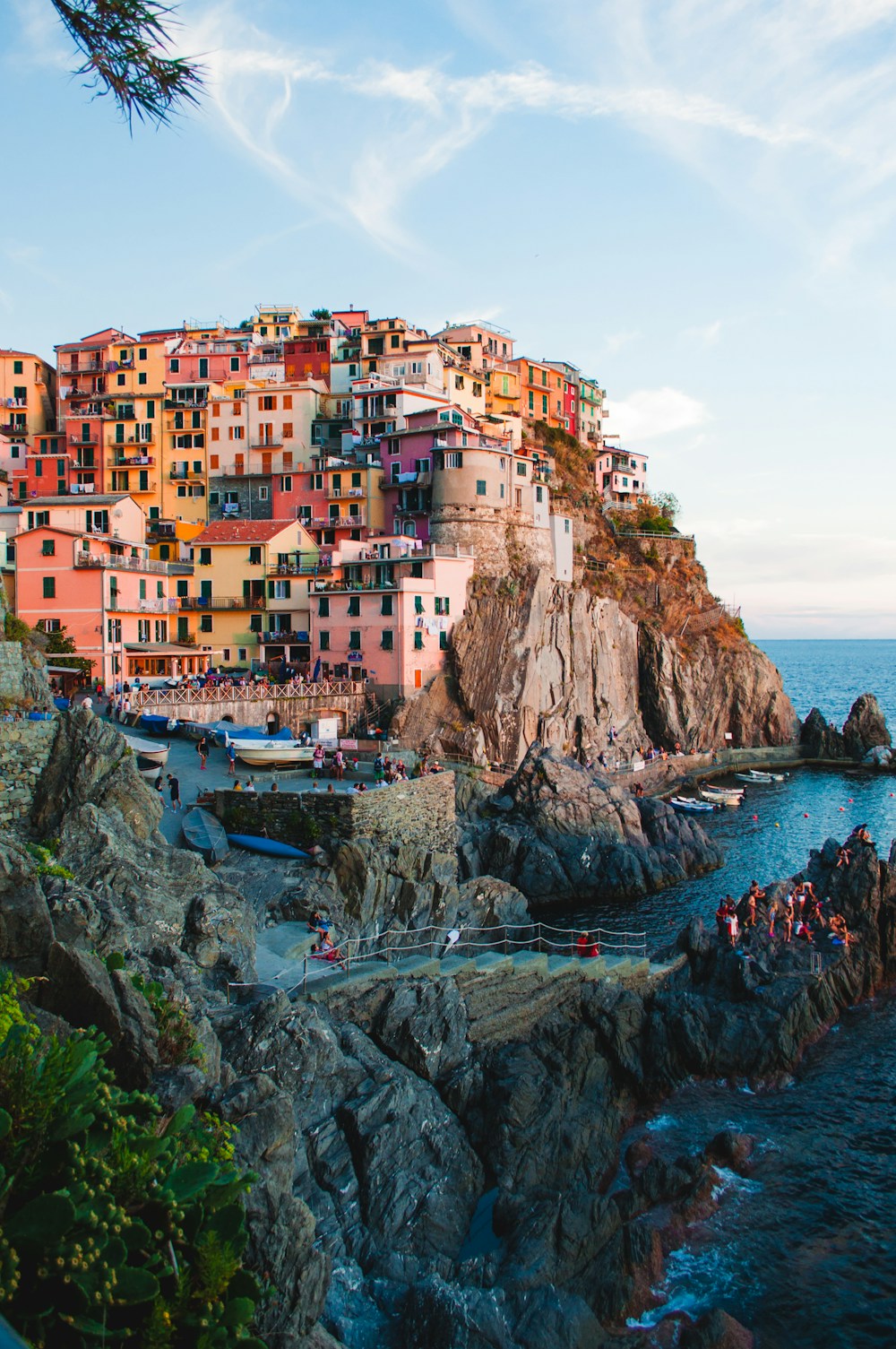 Colorful buildings along a sunlit coastline